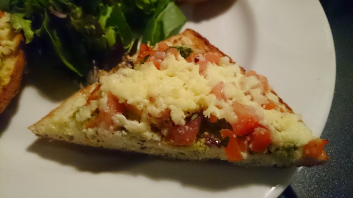 Umago's Bruschetta - Homemade bread drizzled in olive oil, toasted & topped with tomato, basil, onion & melted fetta