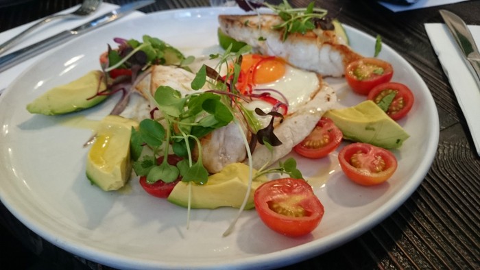 Pan fried local snapper with a chilli-fried egg, avocado, tomato, line and a corn tortilla