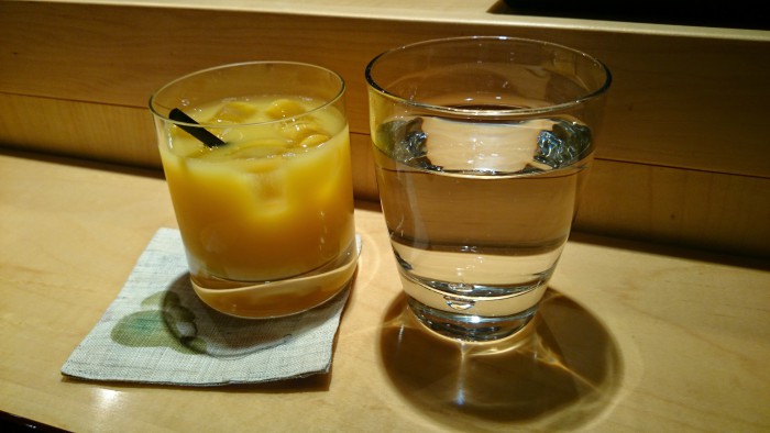 Orange juice and a water