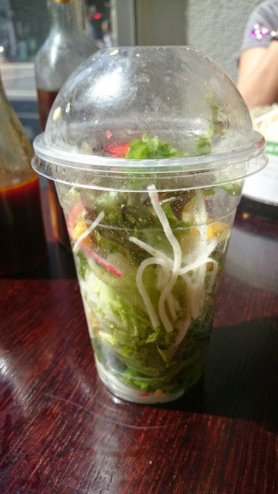 Side of salad in a cup shaken